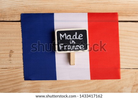 quality concept - French flag and blackboard with Text Made in France