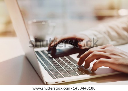 Lifestyle education student. Businessman work on laptop for project. Millennial at home office looking for job on notebook. Unrecognizable man using modern portable computer. Royalty-Free Stock Photo #1433448188