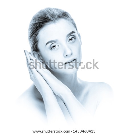 Pretty relaxed smiling girl after spa procedures, black and white image in high key style with blue toning and soft vignetting