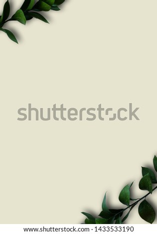 Green leaves isolated on white copyspace background. Foliage branches in the left top and right bottom side with free space for text. Vertical design sample for invitation, banner, label, web design.