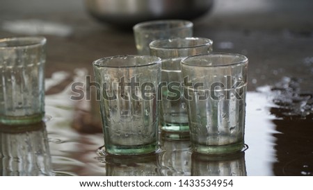 empty tea glass  with water drop at village tea shop