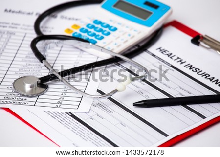 Health care costs. Stethoscope and calculator symbol for health care costs or medical insurance.