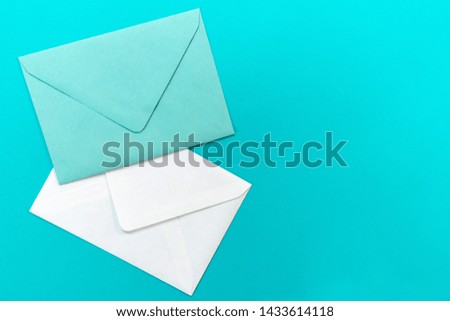 Blue and white envelopes are isolated on a light blue background. Concept greeting card.Copy space.
