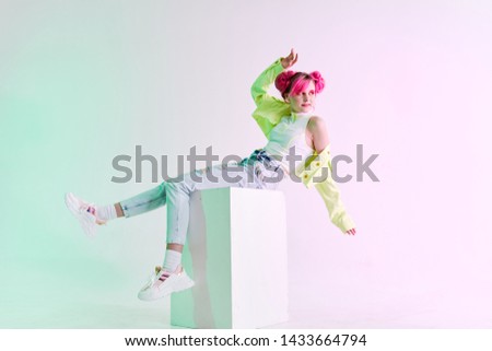 woman with pink background jeans green retro style