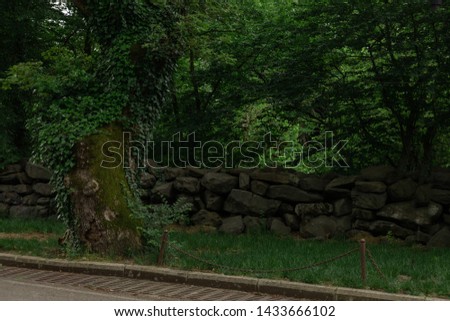 The ancient walls of the ruins and the laying of old stones. Texture background for design.