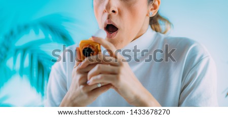 Woman using Spirometer, Measuring Lung Capacity and Force Expiratory Volume Royalty-Free Stock Photo #1433678270