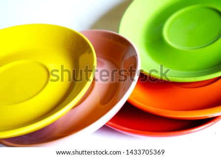 Dishes of yellow and green colors placed informally. Royalty-Free Stock Photo #1433705369