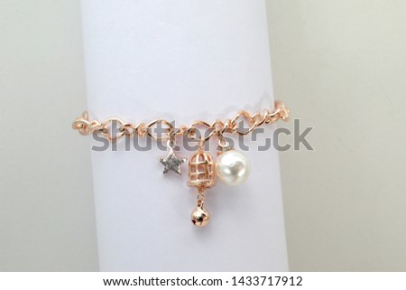 women's gold bracelet on whit background jewelry, gold bracelet with stones, women's jewelry, a girl with a bracelet on her arm, a bracelet with stones