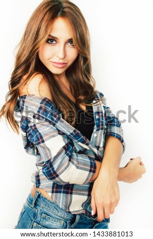 young pretty teenage hipster girl posing emotional happy smiling on white background, lifestyle people concept close up