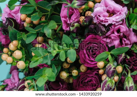 Variety if different color and type of roses and other flowers