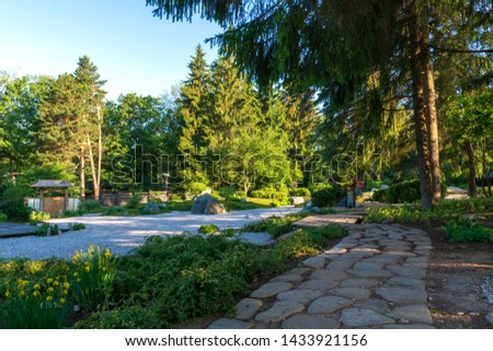 Beautiful view at dawn of park with stone path