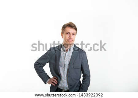 Funny man in a jacket, on a white background. Smart guy with a funny facial expression. Biznismen humor