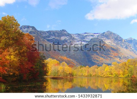 Mountains and a lake  in Autumn on a crisp sunny afternoon                                           