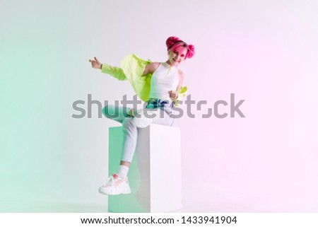 woman in a green jacket with pink hair style