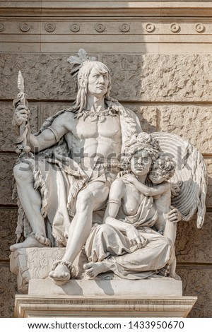 Old symbolic statue of indigenous people of America and Australia, Inca or Indian warier with spire and aborigine woman with a child located in museums district, downtown in Vienna, Austria Royalty-Free Stock Photo #1433950670