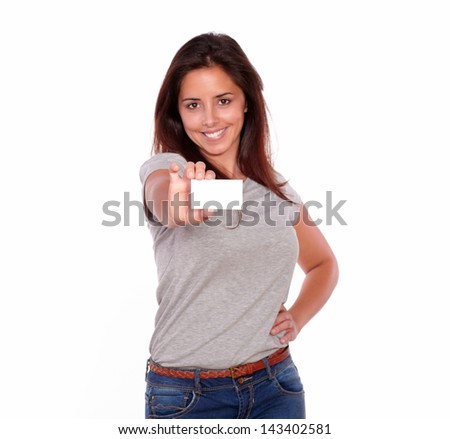 Portrait of a charming young woman holding her business card of copyspace on white background