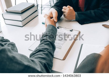smart lawyer handshake with advice in the office before considering the judgment, lawyer concept
