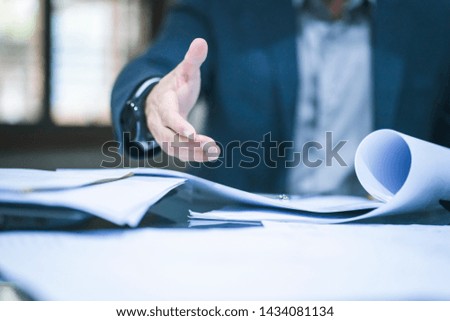 Close up of business man working at office.