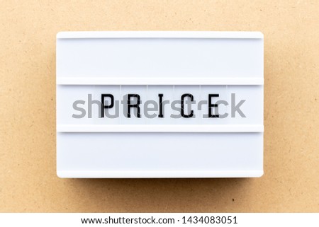 Light box with word price on wood background