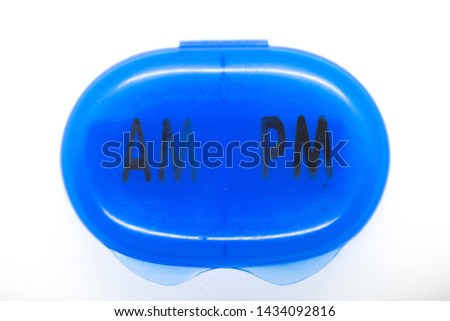 Pill Capsule, AM to PM pill case in the shade of blue.