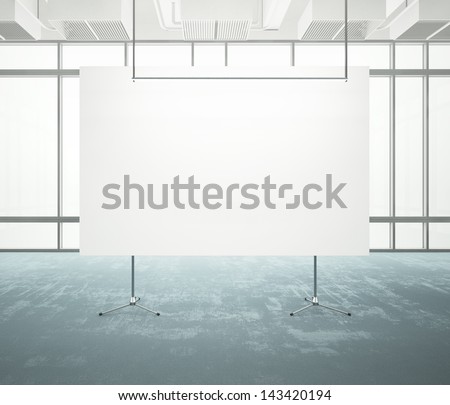 white poster in a bright office