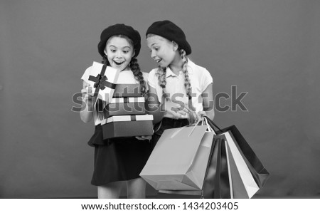 Shopping and holidays. For my dear friend. Girl giving gift box to friend. Girls friends celebrate holiday. Children formal wear with gift box. Open gift now. Friendship concept. Birthday present.