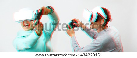 Man and woman with virtual reality headset are playing game. Image with glitch effect.