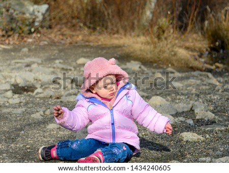 20 months old baby enjoying the nice weather outside. Toddler girl portraits in natural light. Little girl close up pictures in nature, in Winter. Lafarge Lake, Coquitlam, British Columbia, Canada