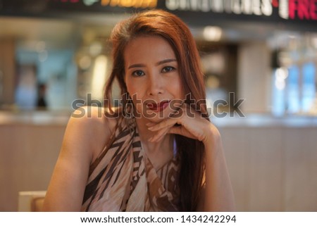 Beautiful woman portrait​ in​ Cafe and relaxing 