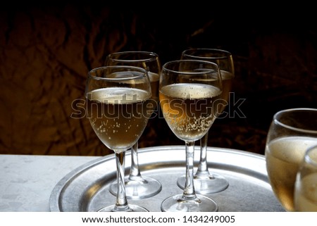 Glasses with sparkling wine on a metal dressing. Party and holiday celebration concept. 