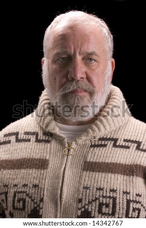 older man looking like Ernest Hemingway isolated on black