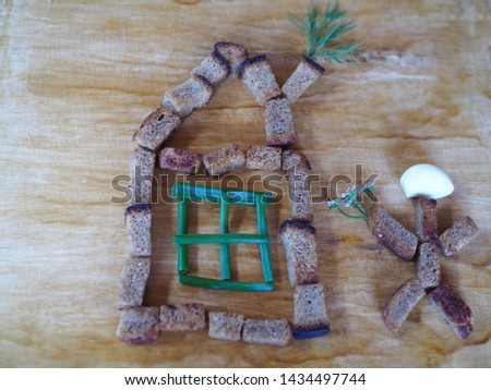 The original picture of rye crackers and herbs for children. Children's entertainment in the kitchen.