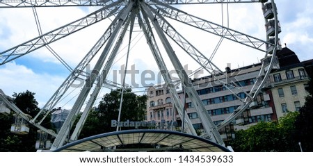 Budapest Eye ferris-wheel or big wheel in Budapest, Hungary, Europe on a cloudy summer day