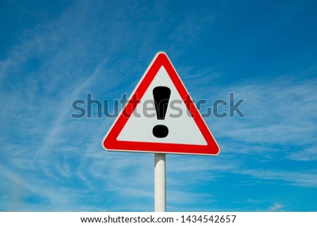 Exclamation point of attention against the sky. triangular sign. Danger, warning. Royalty-Free Stock Photo #1434542657