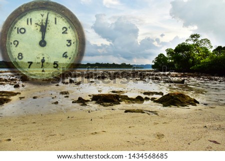 Time and tide wait for none, concept. Tide in the morning. Sea water retreats from the beach on an island in the Andamans.