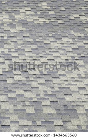 Background mosaic texture of flat roof tiles with bituminous coating