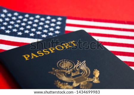 American flag and passport on red background. Independence Day concept, 4th of July. 