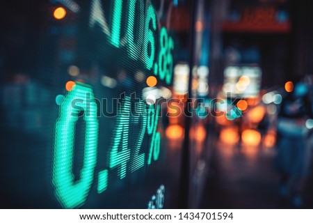 Financial stock exchange market display screen board on the street, selective focus

