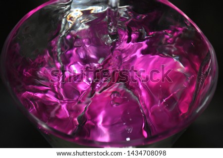 This picture is about water with a really nice purple color in the water