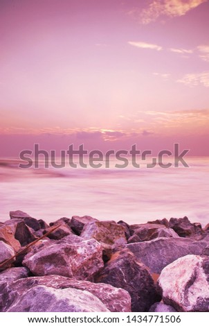Motion blur of sea beach in the morning ,Violet tone