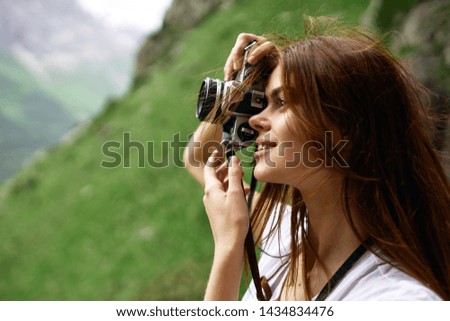 woman with camera nature landscape snapshots
