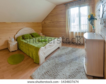 The interior of the hotel. Beautiful, magnificent view, background, panorama of a wooden, retro and vintage style interior of a cozy bedroom, hotel rooms, villa rooms, houses, summer day.