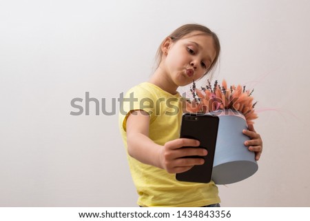 beautiful child makes a selfie