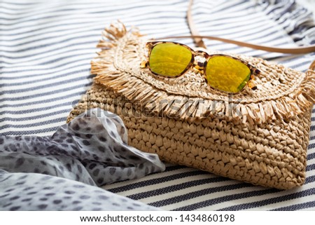 Yellow Lens Sunglasses and Straw Purse