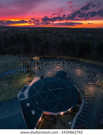 Beautiful aerial shot over a church at sunset