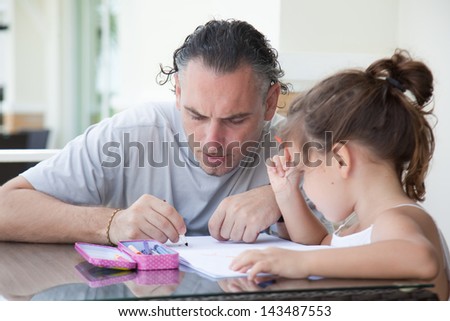 Dad and daughter draw outside his country house