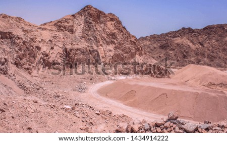 quarry desert scenery landscape place with sand stone rocks and trail on a ground in empty wasteland hot wilderness environment 
