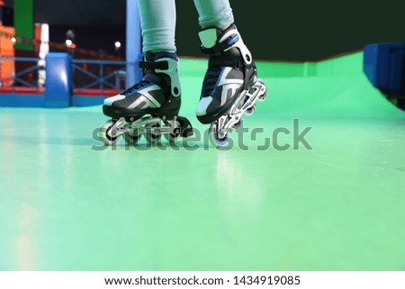 Person with roller skates at rink, closeup
