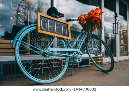 Open signboard. Back to work. Reopen businesses. Bicycle.Creative sign for the store Royalty-Free Stock Photo #1434930002