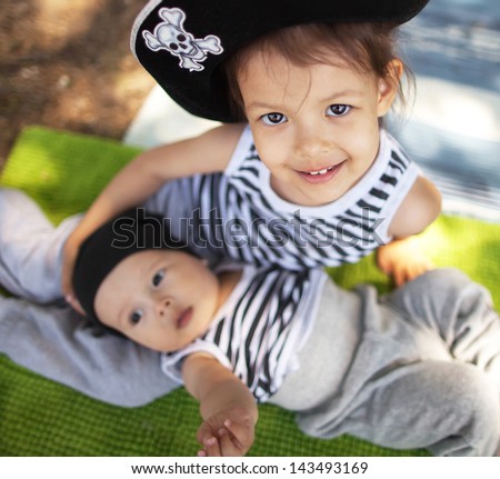The little boy and girl in pirate costume